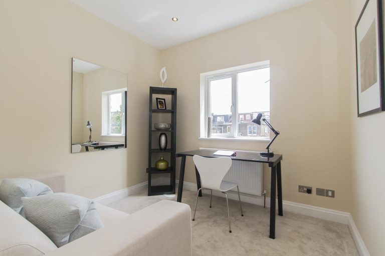 Featured bedroom office in Acton townhouse with a modern and functional design