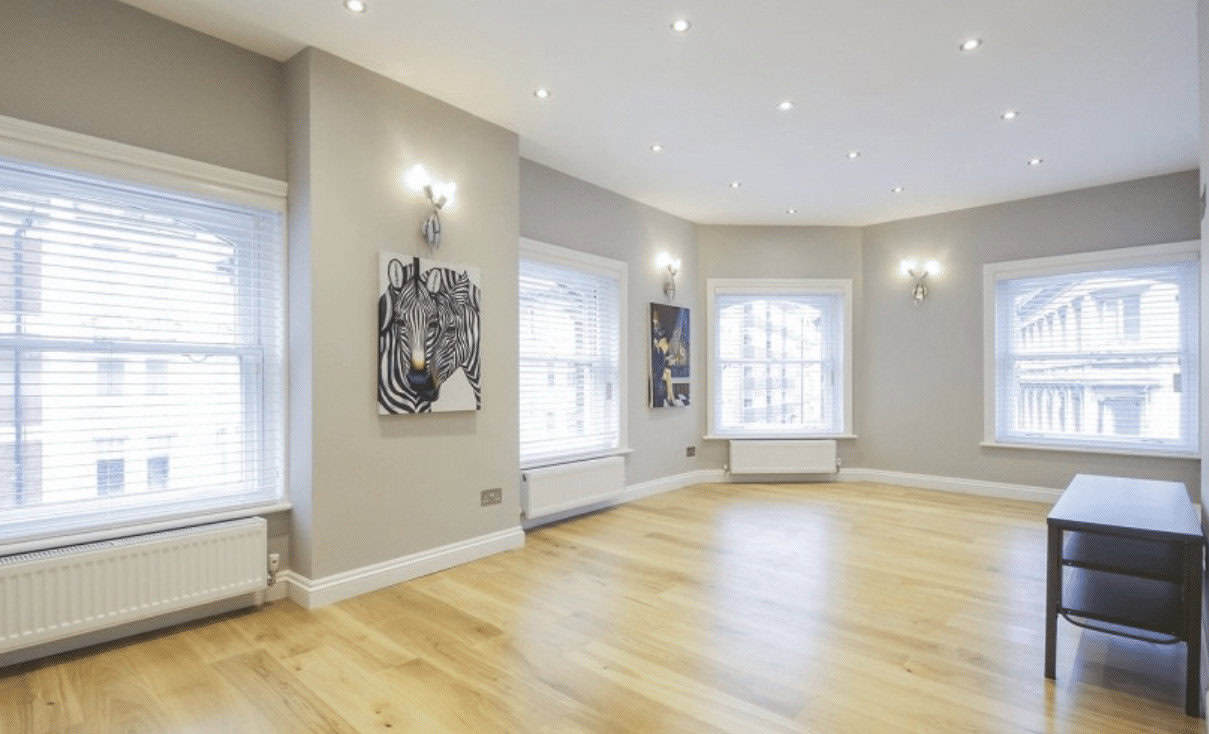 Open-plan living room in The West End Penthouse, featuring a modern and luxurious design